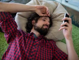 Man text messaging on mobile phone