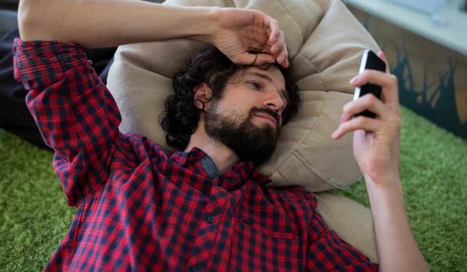 Man text messaging on mobile phone