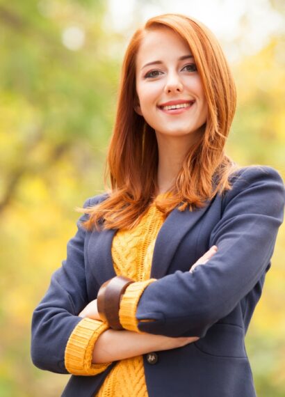 Redhead girl at autumn aoutdoor