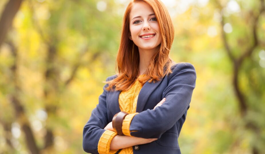 Redhead girl at autumn aoutdoor