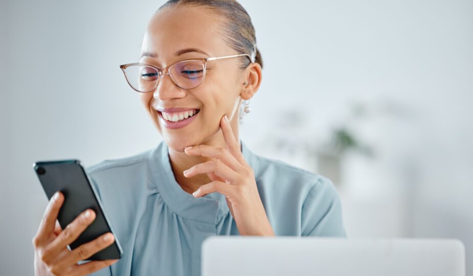 Smiling, excited and happy business woman texting, browsing and reading notification on phone with