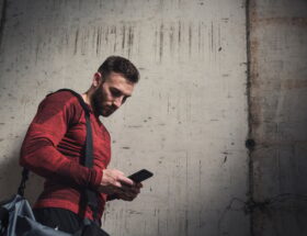 Sportsman typing a text message