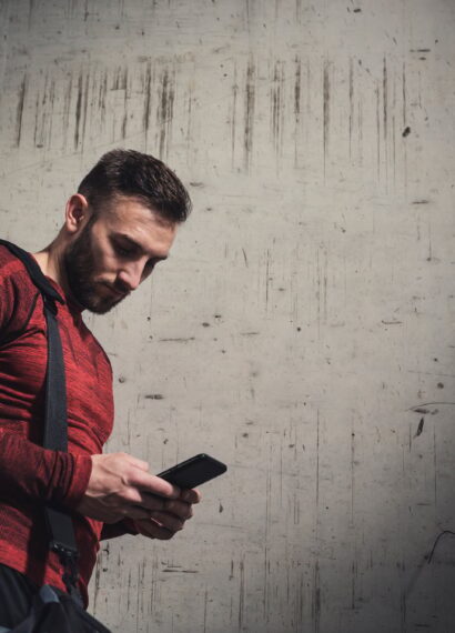 Sportsman typing a text message