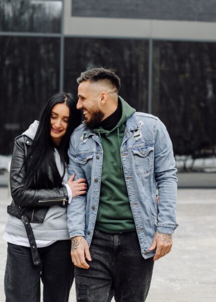 Outdoor happy couple in love posing near cafe